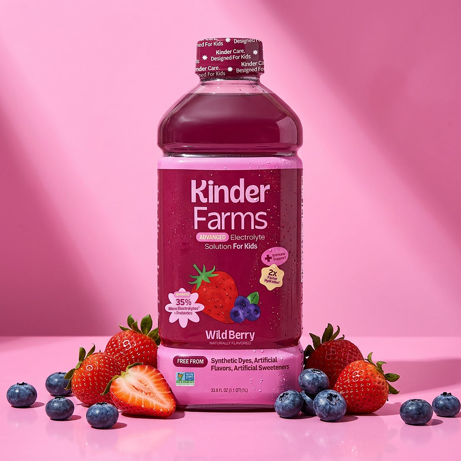Kinder Farms Advanced Electrolyte Solution for Kids in Wild Berry flavor, shown with scattered berries against a soft pink backdrop.