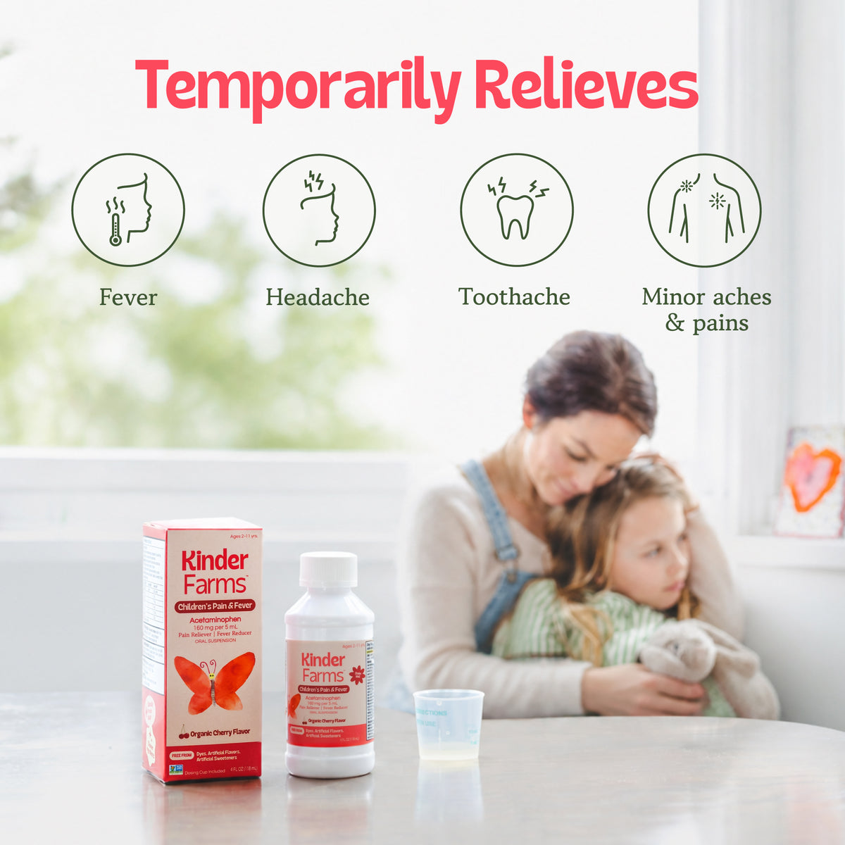 Kinder Farms Children's Pain & Fever medicine bottle and box shown with icons for symptoms relieved and a mother comforting a child in the background. (Item 5 of 15)