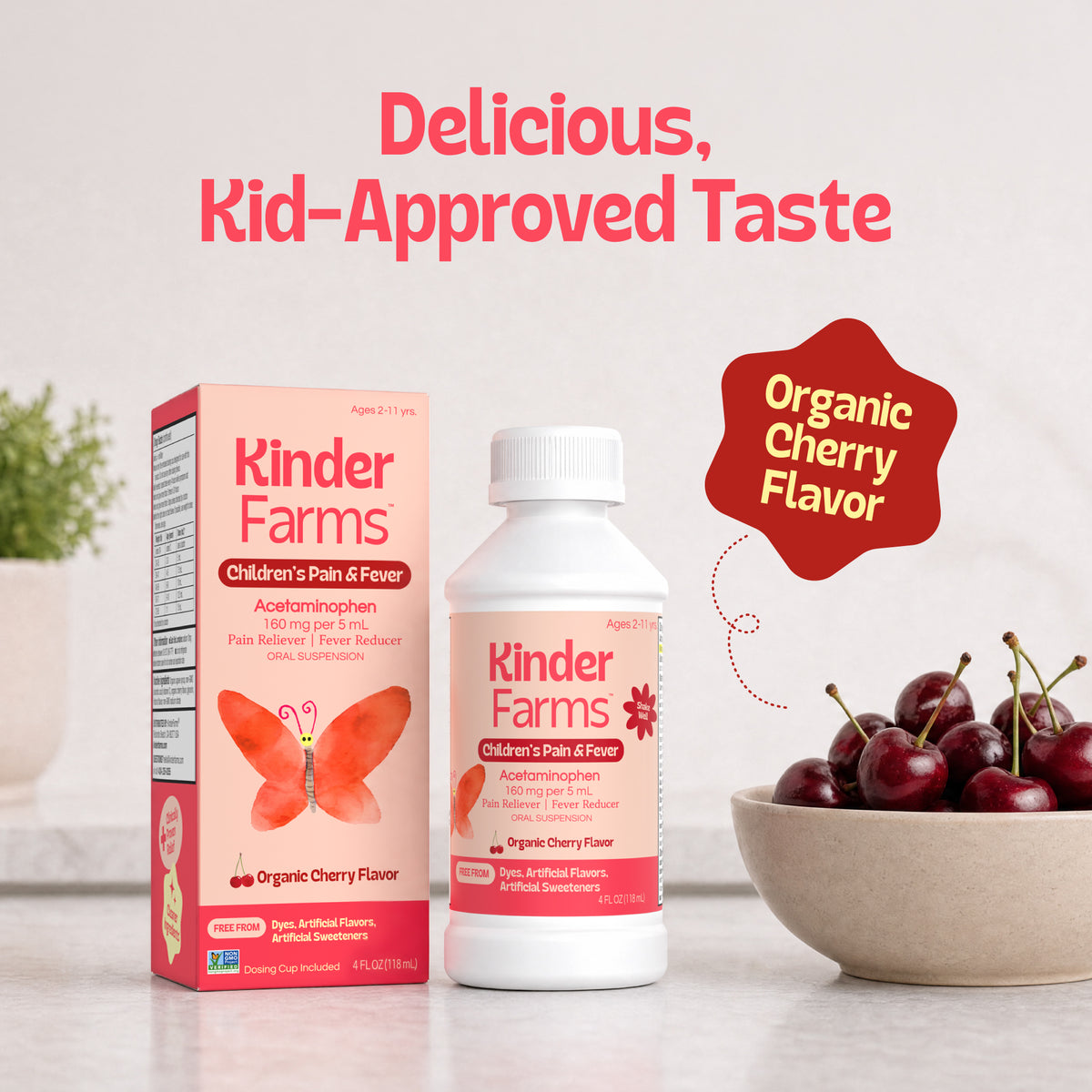 A peach colored box and bottle of Kinder Farms Children's Pain & Fever medicine with a cherry flavor label and a bowl of fresh cherries with the title Delicious, Kid-Approved Taste. (Item 7 of 15)