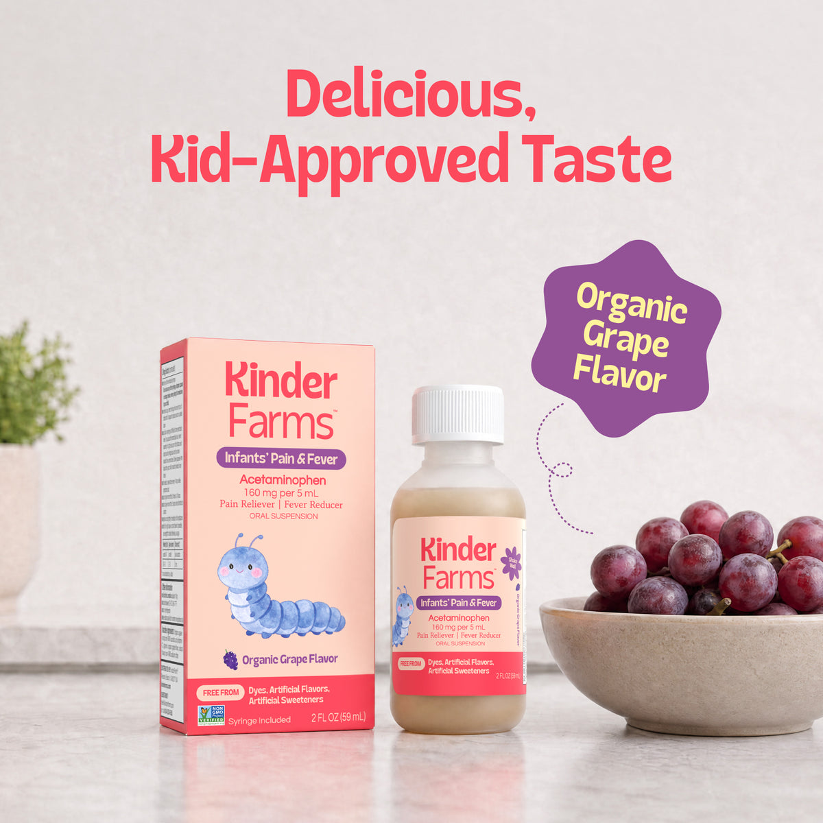Kinder Farms Infants' Pain & Fever liquid medicine in organic grape flavor bottle and a bowl of grapes with text saying "Delicious, Kid-Approved Taste.". (Item 14 of 15)