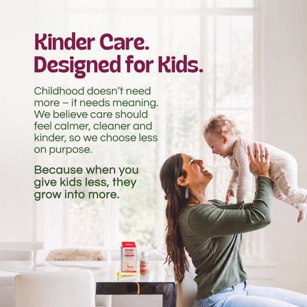 A mother and baby sitting on a rug in a nursery with Kinder Farms medicine. Text at the top lists relief for occasional sleeplessness, coughs, irritated throat, and hoarseness.