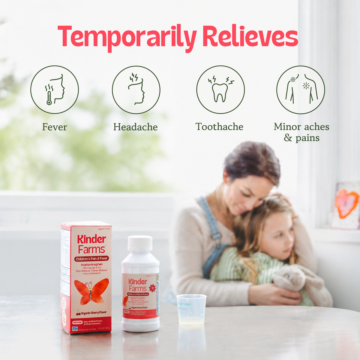 Kinder Farms Children's Pain & Fever medicine bottle and box shown with icons for symptoms relieved and a mother comforting a child in the background. (Item 12 of 15)