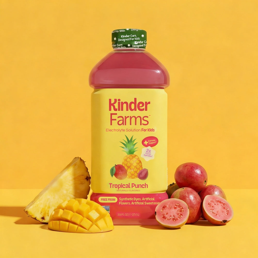 A bottle of Kinder Farms Tropical Punch Electrolyte Solution for Kids surrounded by fresh pineapple, mango, and guava against a yellow background.