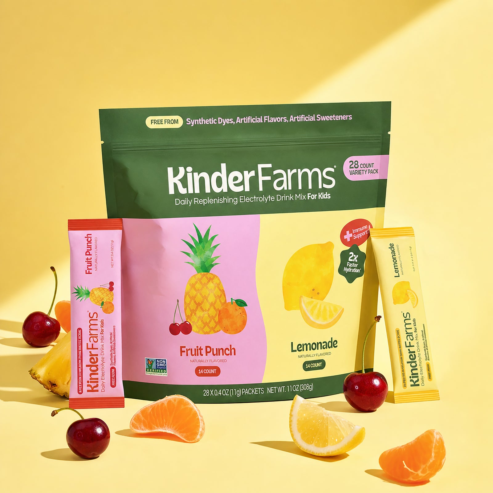 KinderFarms electrolyte drink mix for kids shown in a fruit punch and lemonade flavor pouch with two single-serve stick packs, arranged with fruit slices and cherries on a yellow background.